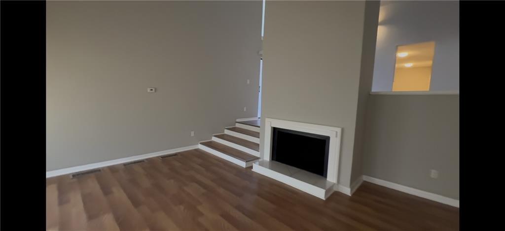 2563 Terrace Trail Decatur, GA 30035 - Photo 4 of 14 a view of an empty room with wooden floor and a window