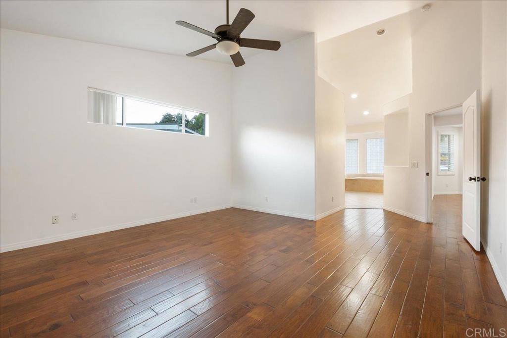 9144 Old Castle Road Valley Center, CA 92082 - Photo 17 of 48 a view of empty room with wooden floor and fan