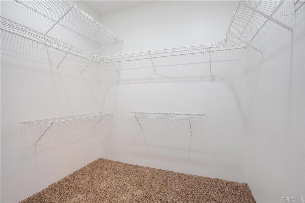 9144 Old Castle Road Valley Center, CA 92082 - Photo 19 of 48 a view of a room with racks on the wall