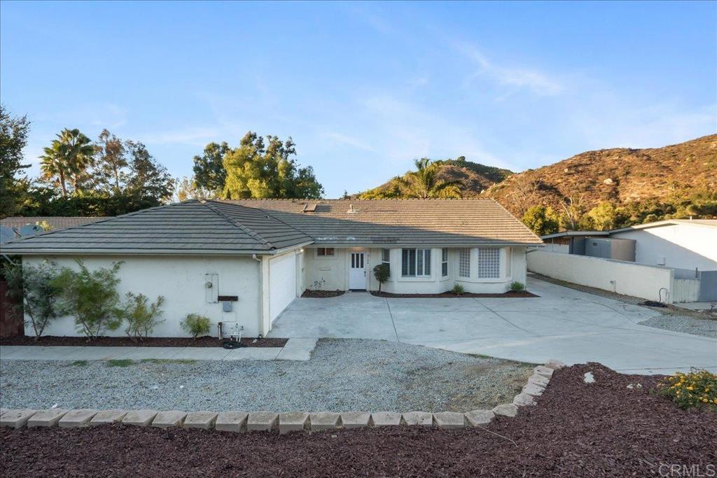 9144 Old Castle Road Valley Center, CA 92082 - Photo 2 of 48 a view of a house with a backyard