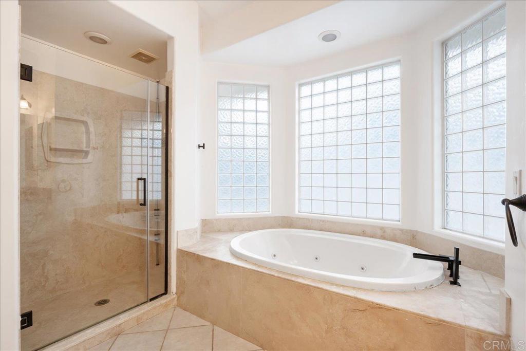 9144 Old Castle Road Valley Center, CA 92082 - Photo 22 of 48 a bathroom with a bathtub and shower