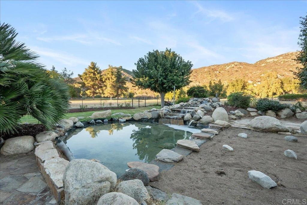 9144 Old Castle Road Valley Center, CA 92082 - Photo 30 of 48 a backyard of a house with lots of green space