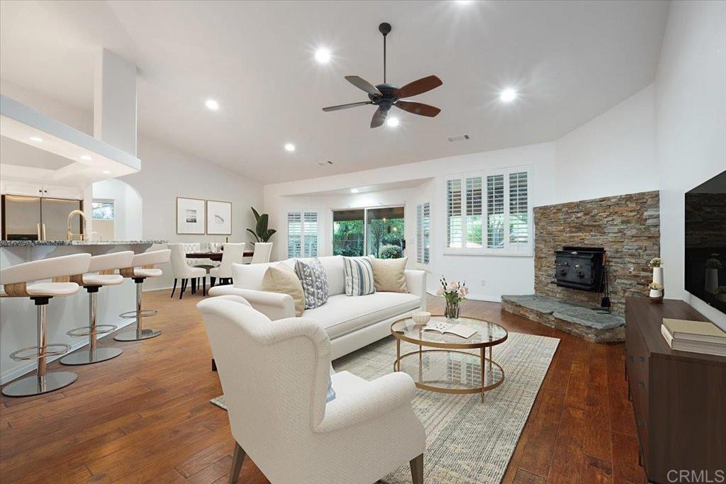 9144 Old Castle Road Valley Center, CA 92082 - Photo 3 of 48 a living room with furniture fireplace and a window