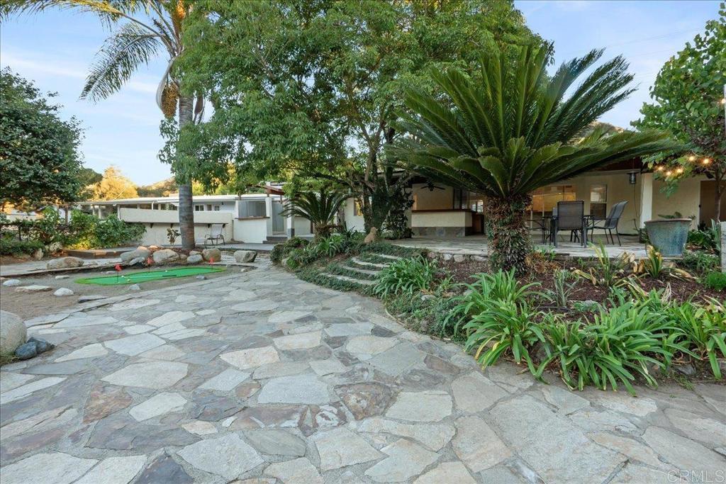 9144 Old Castle Road Valley Center, CA 92082 - Photo 33 of 48 a view of a yard with plants and trees