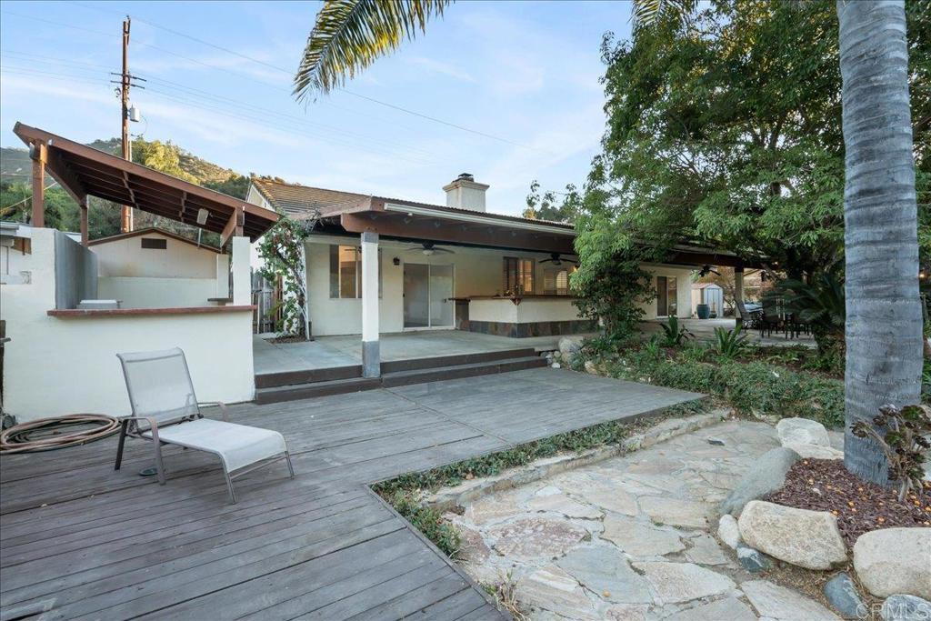 9144 Old Castle Road Valley Center, CA 92082 - Photo 36 of 48 a view of a patio with table and chairs and potted plants