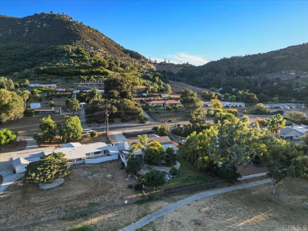 9144 Old Castle Road Valley Center, CA 92082 - Photo 43 of 48 a view of a houses with a yard