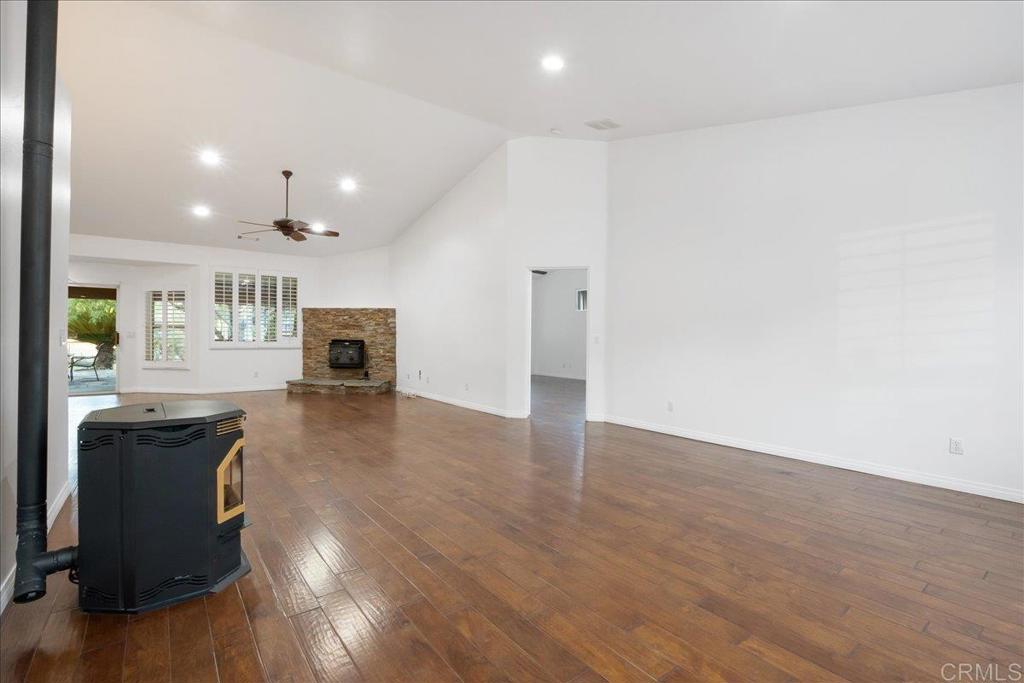9144 Old Castle Road Valley Center, CA 92082 - Photo 9 of 48 a view of a living room a dining room wooden floor and a window