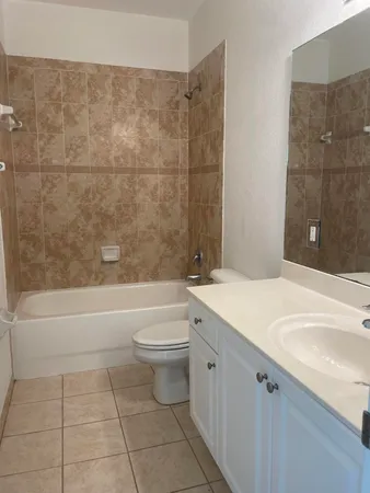 a bathroom with a sink a toilet and bathtub