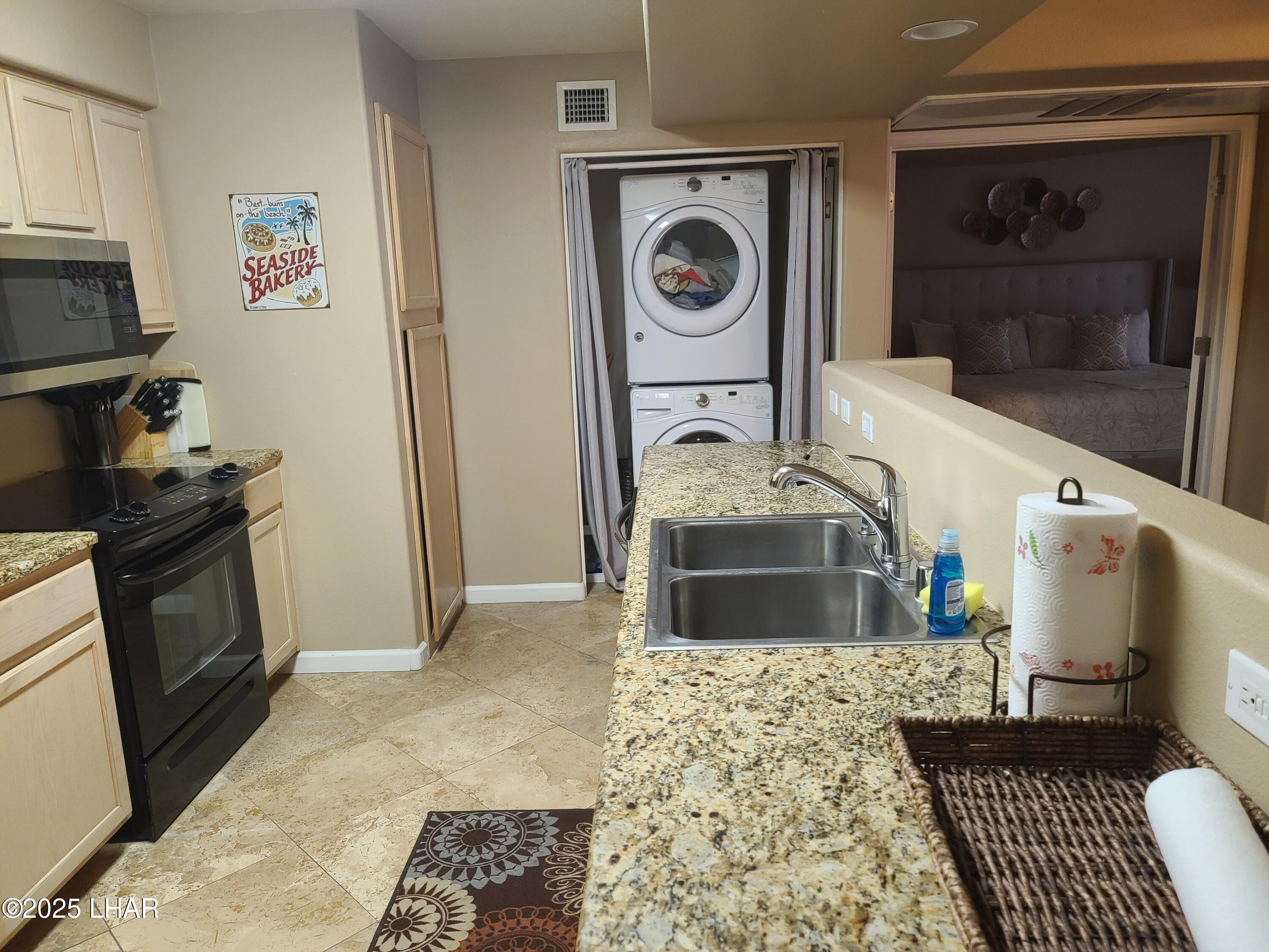 94 London Bridge Road, Unit 108 Lake Havasu City, AZ 86403 - Photo 31 of 38 a kitchen with a stove and a refrigerator