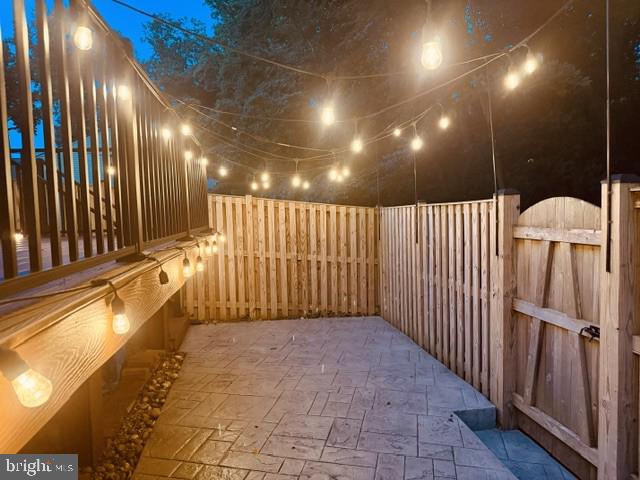 1016 Windrush Lane, Unit 25 Sandy Spring, MD 20860 - Photo 11 of 37 Charming outdoor retreat at dusk.