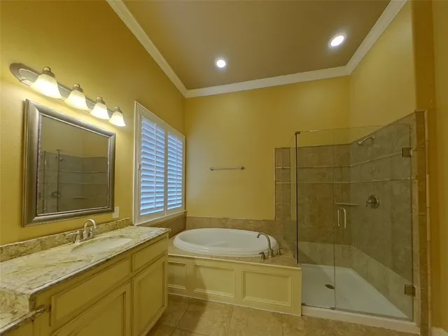 a bathroom with a granite countertop sink a toilet and shower
