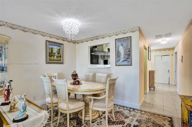 a dining room with furniture a rug and wooden floor
