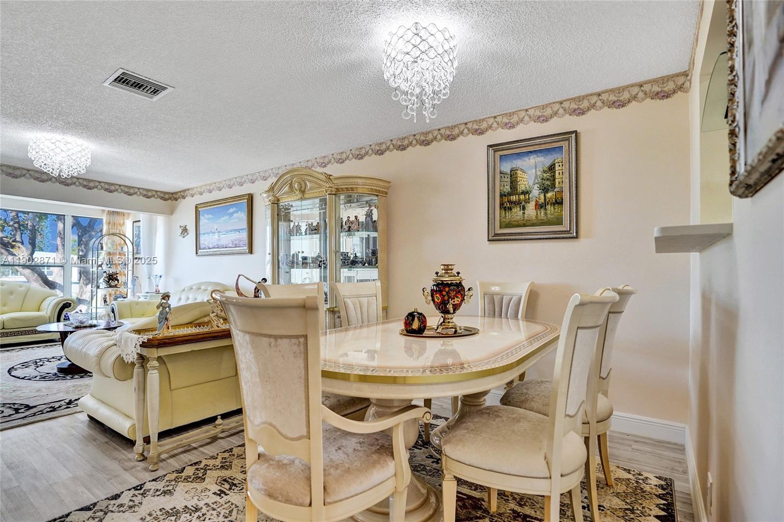 1450 Northwest 18th Avenue, Unit 203 Delray Beach, FL 33445 - Photo 14 of 30 a view of a dining room with furniture