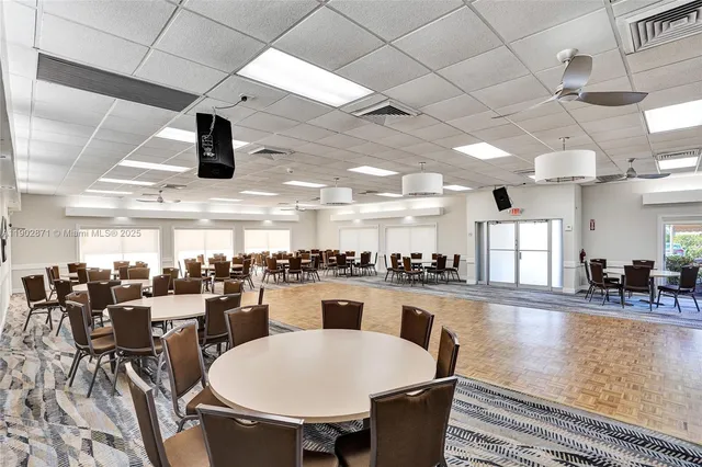 a large kitchen with a table and chairs