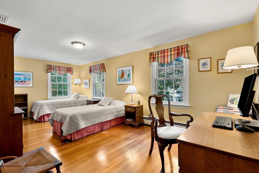 5 Crestwood Road Marblehead, MA 01945 - Photo 19 of 28 a bedroom with a bed a desk and chair with window