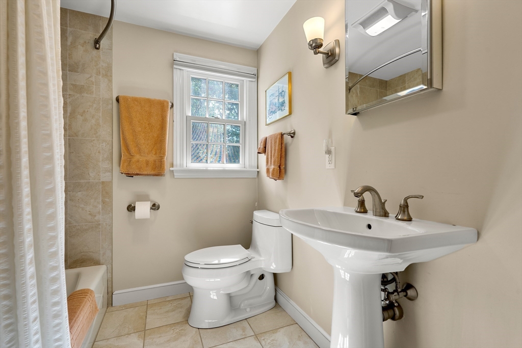 5 Crestwood Road Marblehead, MA 01945 - Photo 20 of 28 a bathroom with a sink a toilet and a mirror