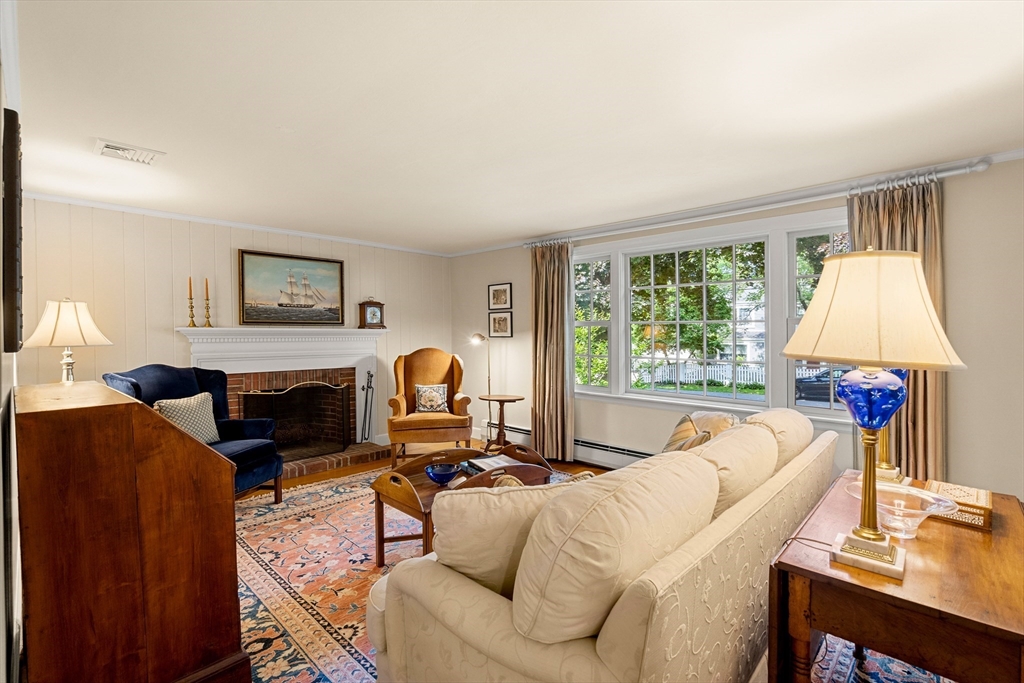 5 Crestwood Road Marblehead, MA 01945 - Photo 2 of 28 a living room with furniture a fireplace and a large window