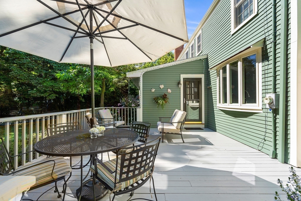 5 Crestwood Road Marblehead, MA 01945 - Photo 22 of 28 a view of a patio with a table chairs and a barbeque