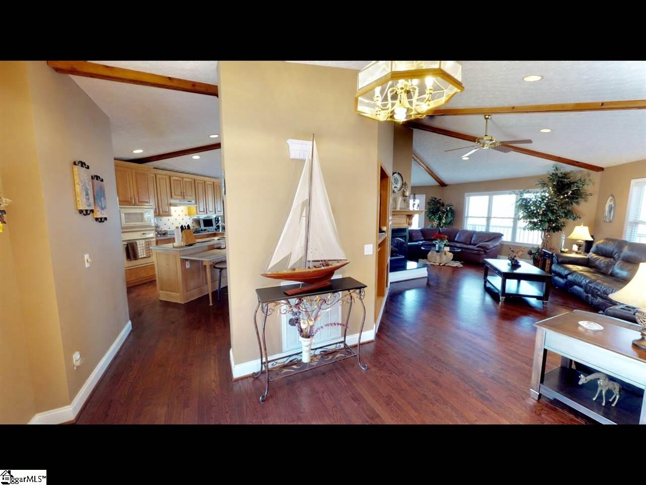 455 Cleveland Ferry Road Fair Play, SC 29643 - Photo 14 of 36 Octagonal shape - Dimmable recessed lighting - Ceiling fans - Peninsula 3-sided ventless log fireplace- Walk out to wrap around deck - Beautiful lake views