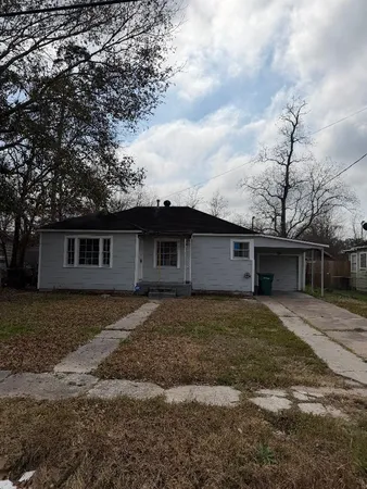 a front view of a house with yard