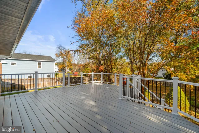 a view of a balcony with wooden floor