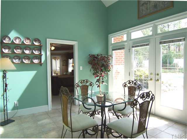 908 Rockfall Court Raleigh, NC 27614 - Photo 9 of 25 Nearby is the vaulted SunRm w/tile flr, 3 skylights & French drs to the beautiful backyard. Sun Room