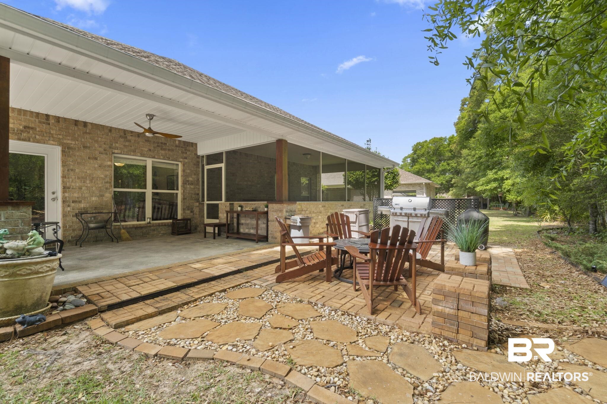 8664 Foxtail Loop Pensacola, FL 32526 - Photo 48 of 64 View of patio with ceiling fan, a sunroom, and outdoor dining area