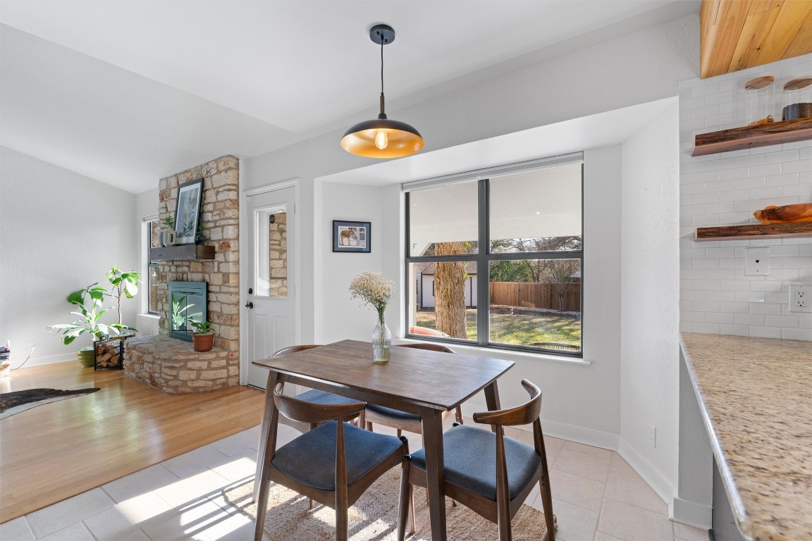 1204 Dunman Drive Georgetown, TX 78628 - Photo 12 of 40 a view of a dining room with furniture window and wooden floor