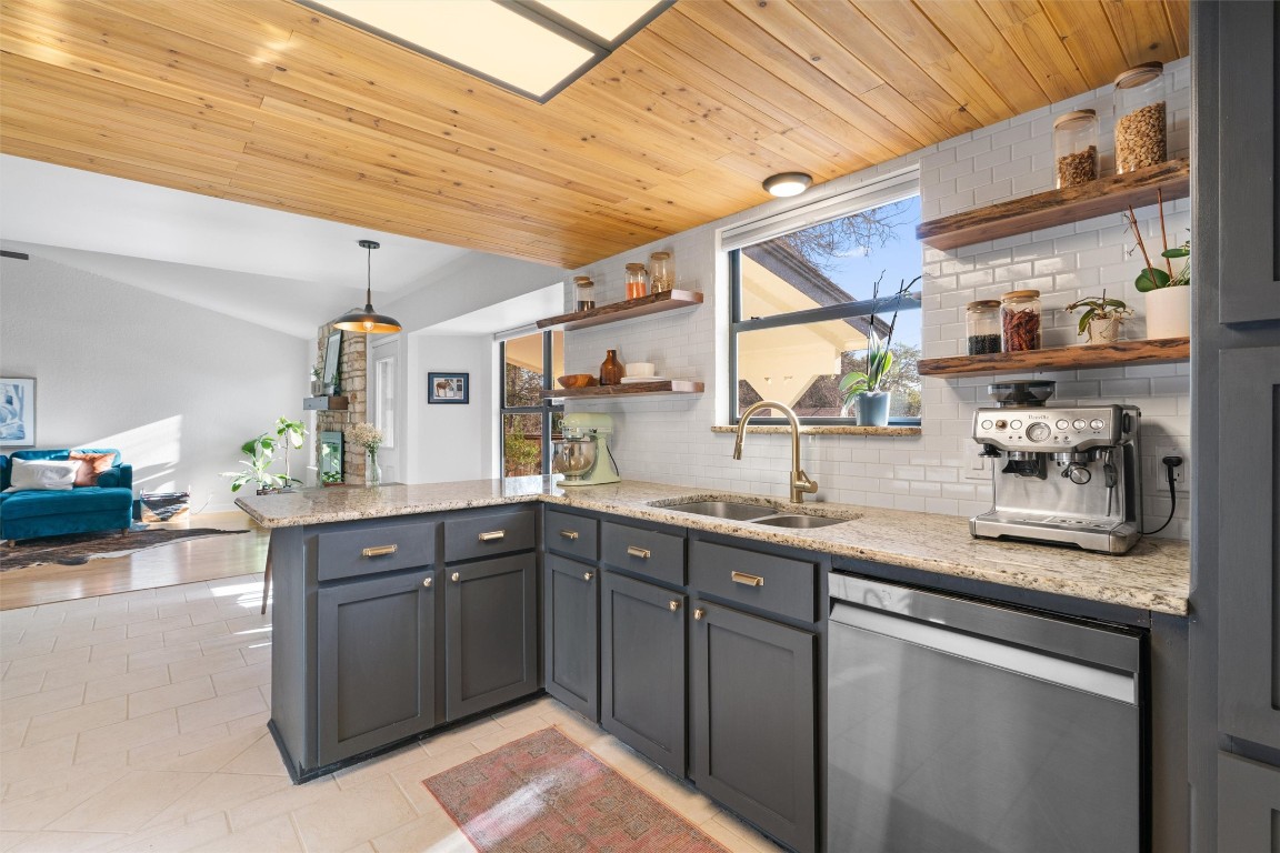 1204 Dunman Drive Georgetown, TX 78628 - Photo 14 of 40 a kitchen with sink a window and cabinets