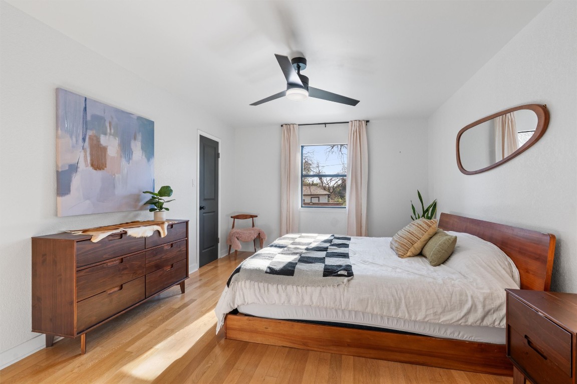 1204 Dunman Drive Georgetown, TX 78628 - Photo 16 of 40 a bedroom with a bed and a dresser