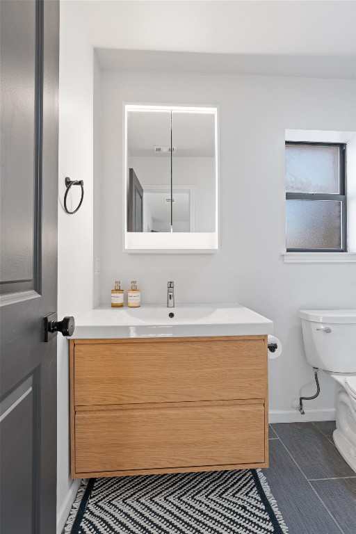 1204 Dunman Drive Georgetown, TX 78628 - Photo 20 of 40 a bathroom with a sink a toilet and mirror