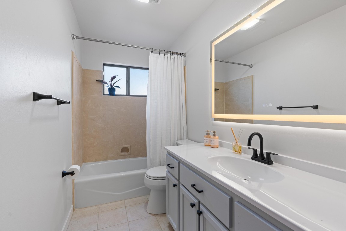 1204 Dunman Drive Georgetown, TX 78628 - Photo 23 of 40 a bathroom with a sink a toilet and shower