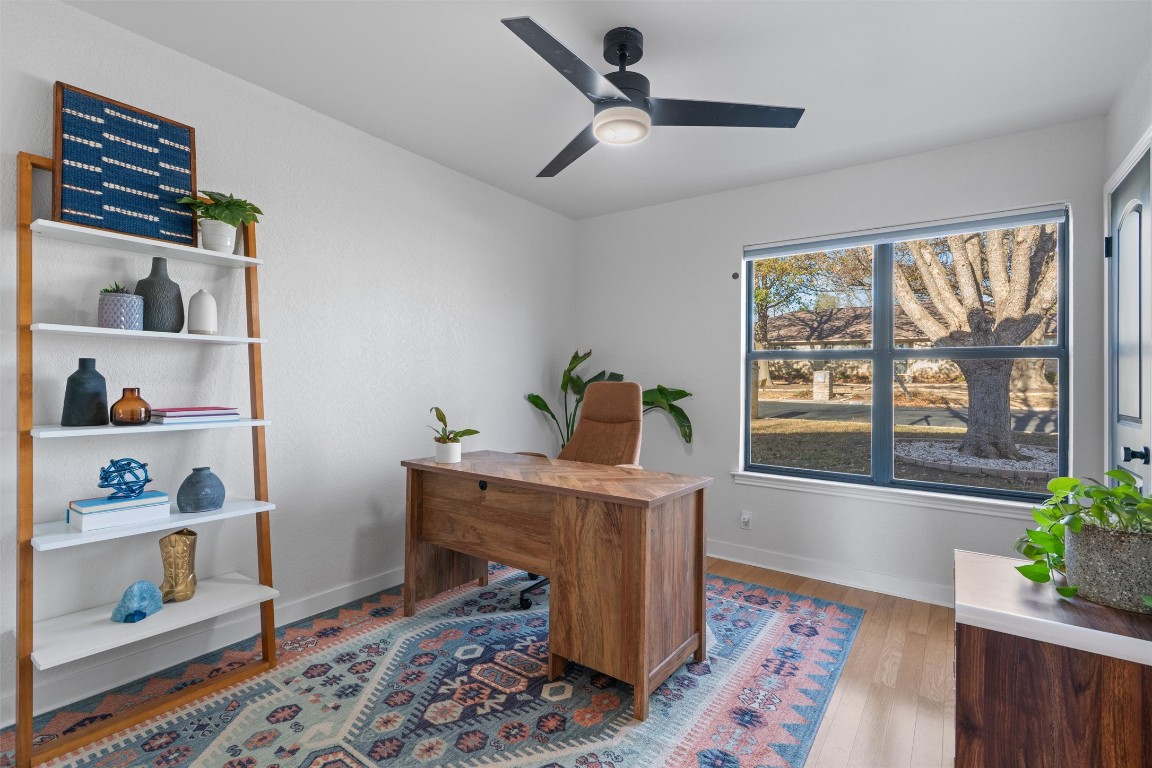 1204 Dunman Drive Georgetown, TX 78628 - Photo 24 of 40 a workspace with furniture and window