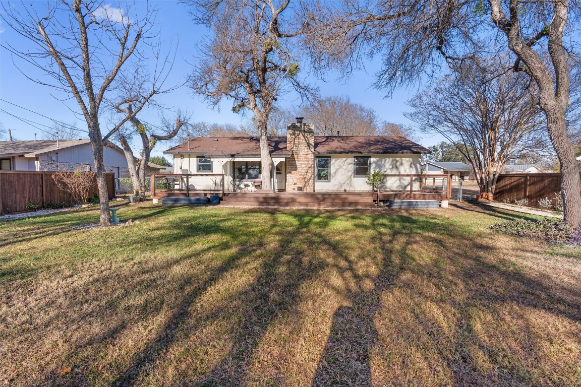 1204 Dunman Drive Georgetown, TX 78628 - Photo 35 of 40 a city street lined with buildings and trees