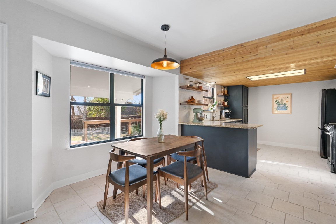 1204 Dunman Drive Georgetown, TX 78628 - Photo 6 of 40 a view of a dining room with furniture window and outside view