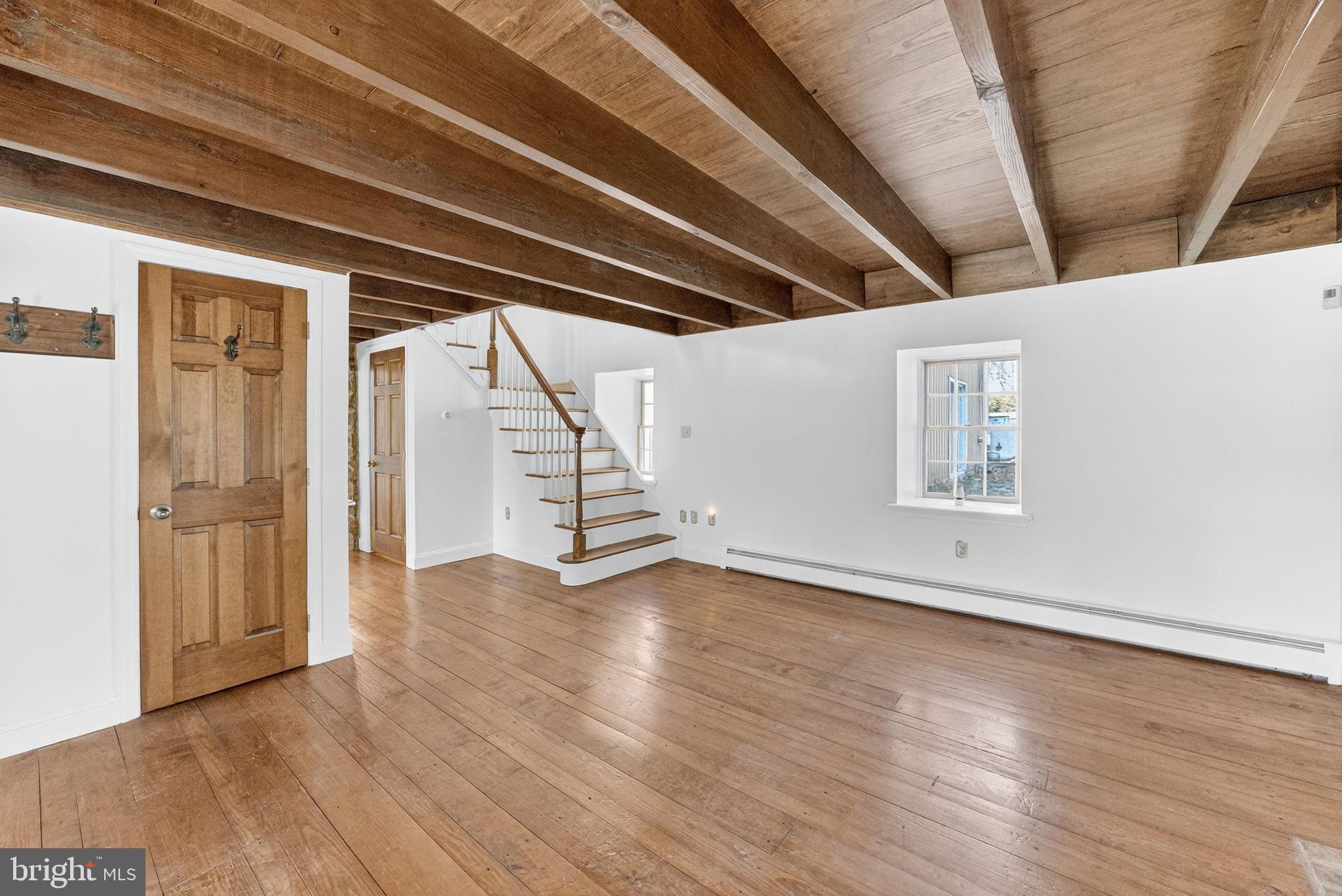 275 Sally Ann Furnace Road Mertztown, PA 19539 - Photo 13 of 33 Spacious room with rustic wooden beams.