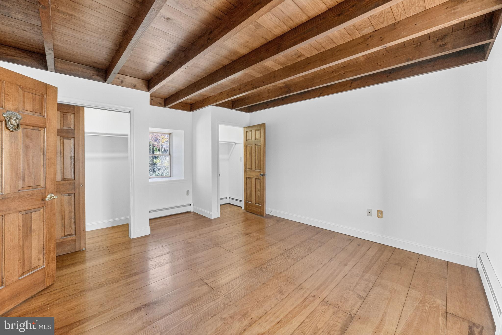 275 Sally Ann Furnace Road Mertztown, PA 19539 - Photo 21 of 33 Spacious room with rustic wooden beams.