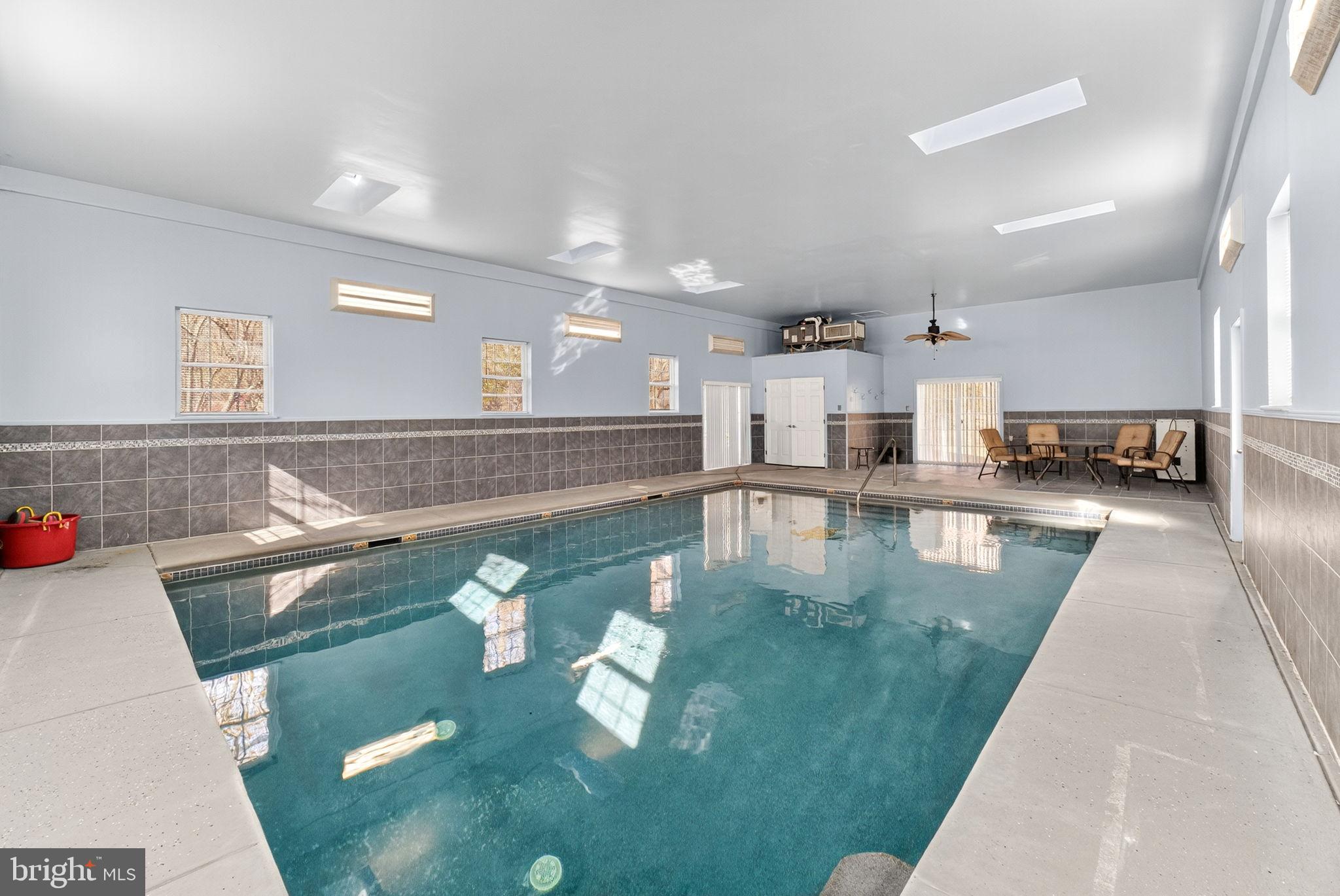 275 Sally Ann Furnace Road Mertztown, PA 19539 - Photo 27 of 33 Indoor oasis with a serene swimming pool.