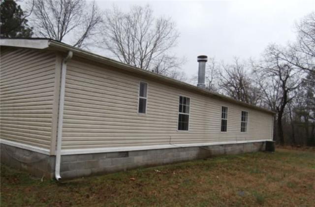 140 Sam Hollow Road Dickson, TN 37055 - Photo 2 of 11 a back view of a house with a yard