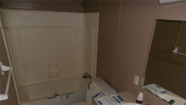 140 Sam Hollow Road Dickson, TN 37055 - Photo 11 of 11 a bath room with a shower and a toilet