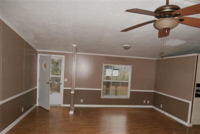 140 Sam Hollow Road Dickson, TN 37055 - Photo 5 of 11 a view of empty room with wooden floor