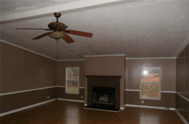 140 Sam Hollow Road Dickson, TN 37055 - Photo 6 of 11 a hallway with a fireplace in it