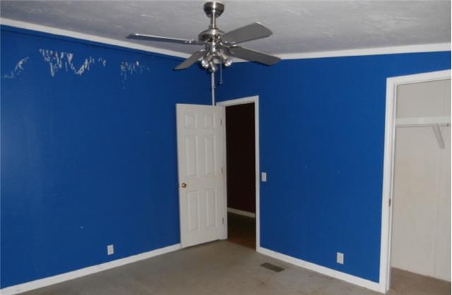 140 Sam Hollow Road Dickson, TN 37055 - Photo 10 of 11 a view of a hallway with a chandelier fan