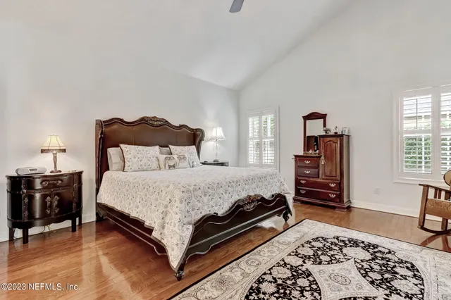 a bathroom with a sink toilet vanity and shower
