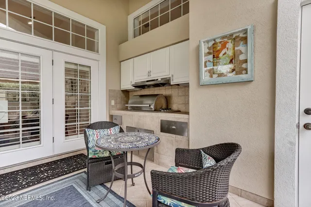 an aerial view of house with yard swimming pool and outdoor seating
