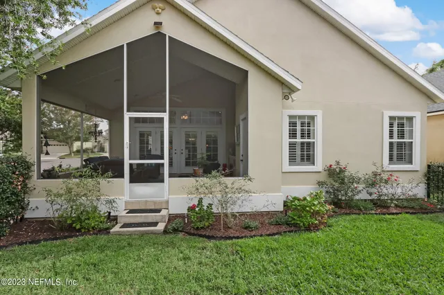 a view of a swimming pool with a lawn chairs and a fire pit