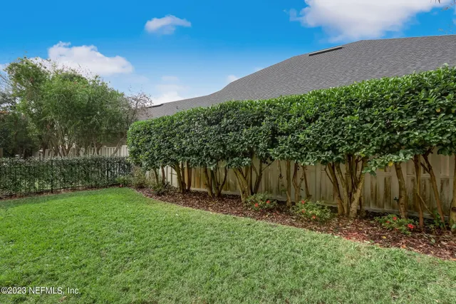 a view of a yard in front of a house