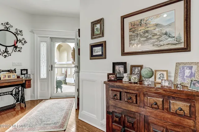 a kitchen with kitchen island granite countertop a sink a counter top space cabinets and stainless steel appliances