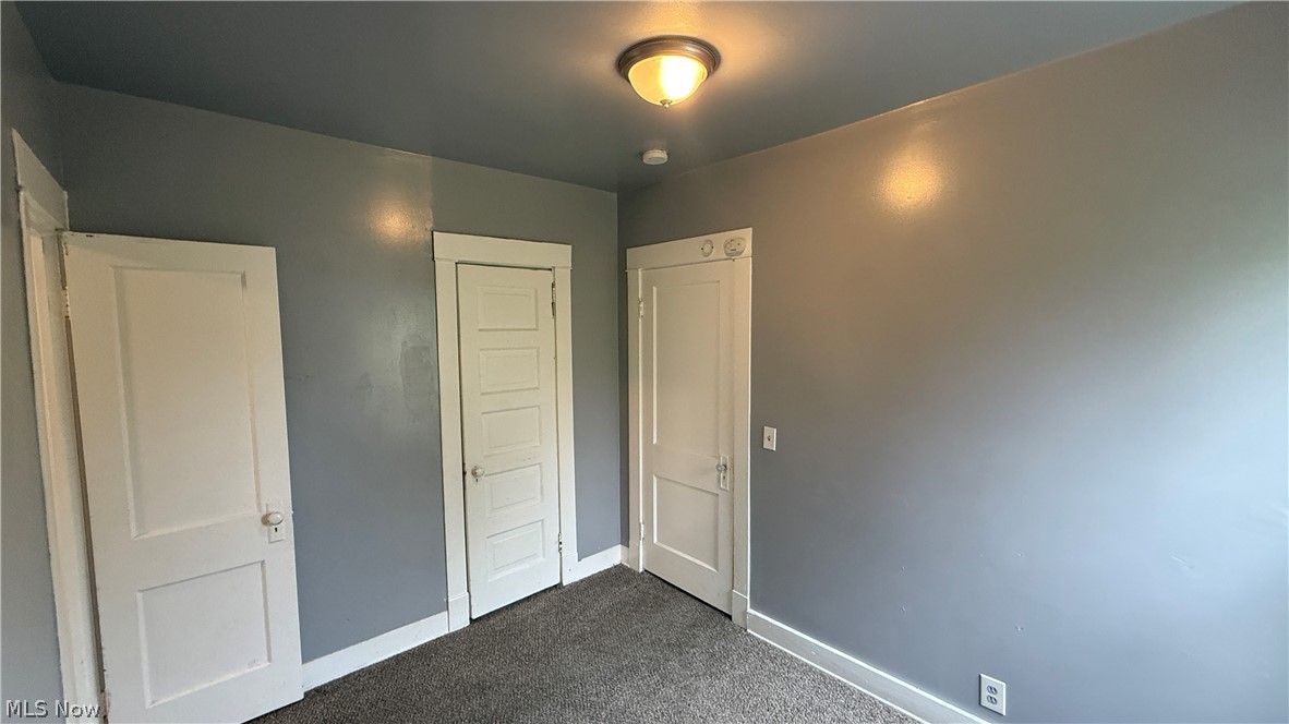 1187 Addison Road, Unit 4 Cleveland, OH 44103 - Photo 14 of 15 Room featuring gray wall paint, gray ceiling paint, and gray carpet