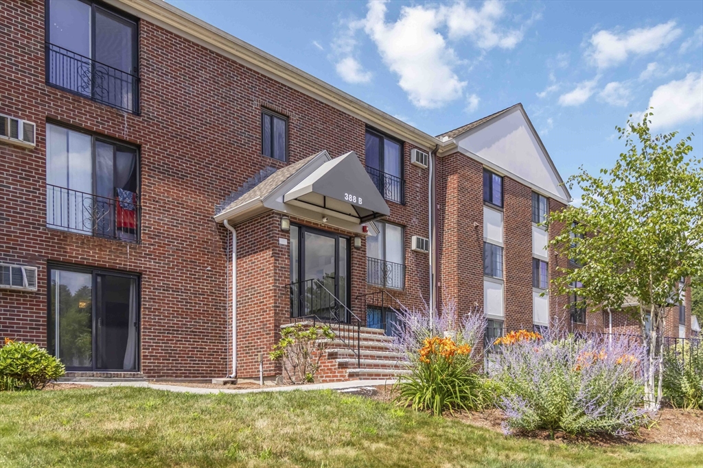 388 Great Road, Unit B14 Acton, MA 01720 - Photo 1 of 24 a front view of house with yard